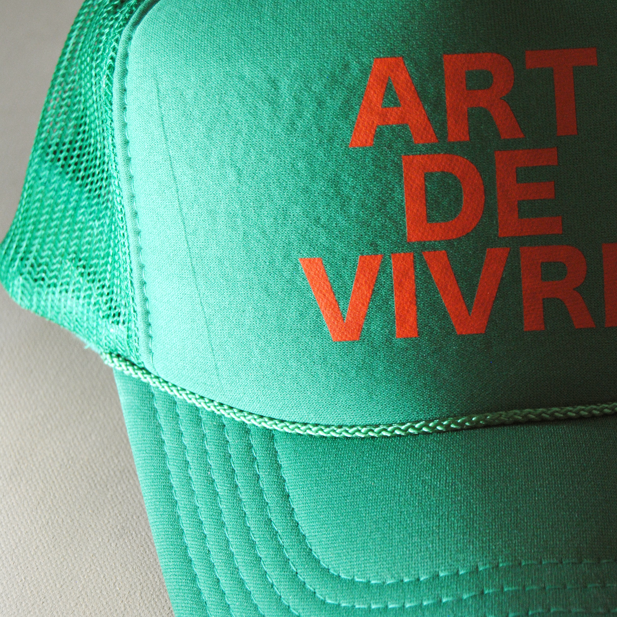 The Art of Living Trucker Hat in Vert